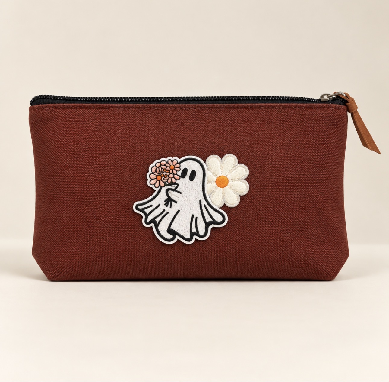 Rust zipper pouch with ghost and daisy patches